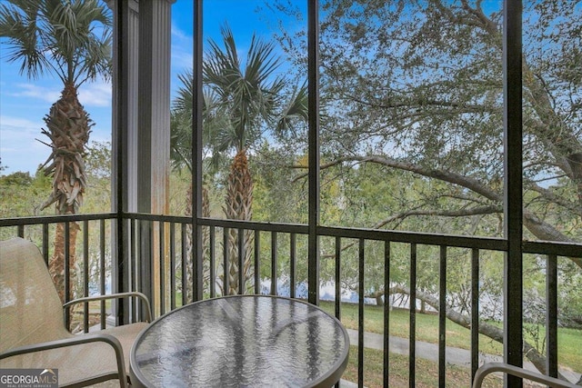 balcony featuring a water view