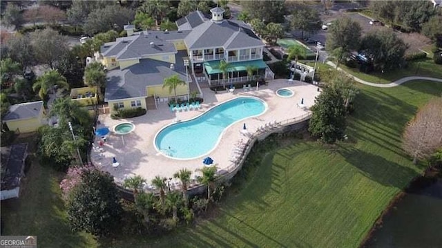 view of pool with a community hot tub and a patio