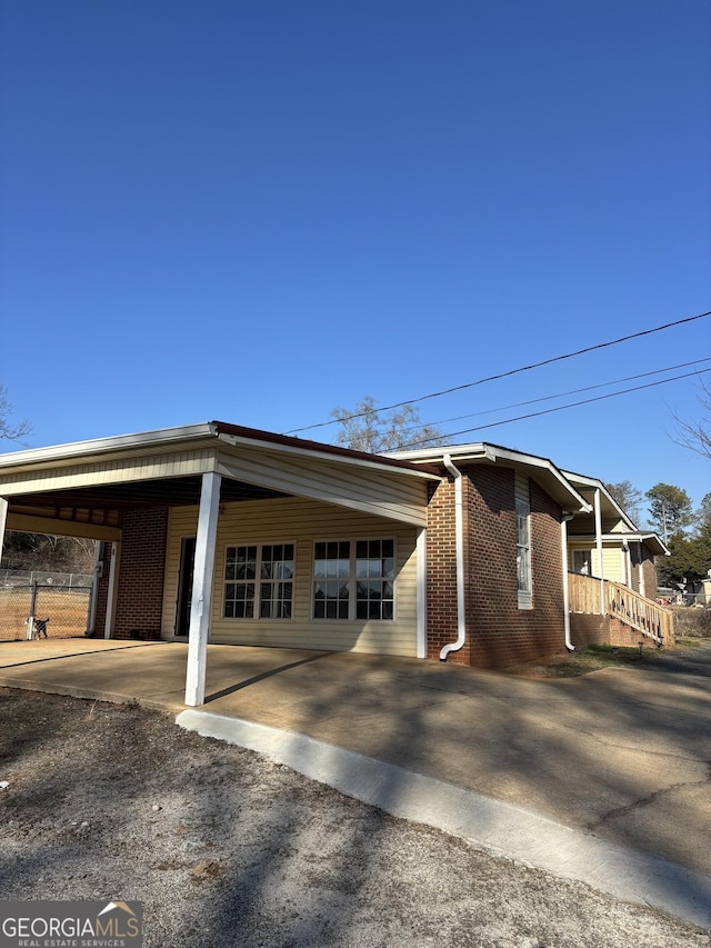 view of front facade with a carport