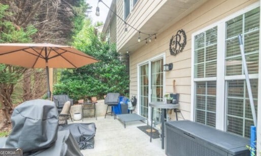 view of patio featuring a grill