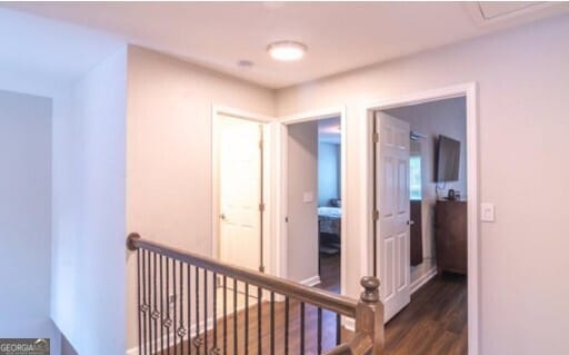 corridor featuring dark hardwood / wood-style flooring