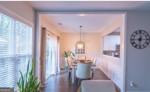 dining room with dark wood-type flooring