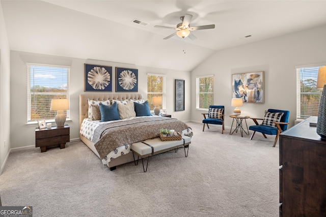 bedroom featuring ceiling fan, light colored carpet, and vaulted ceiling