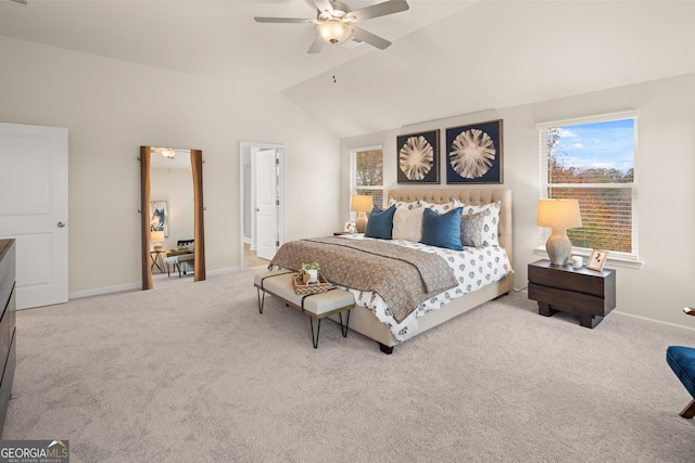 carpeted bedroom with ceiling fan and lofted ceiling