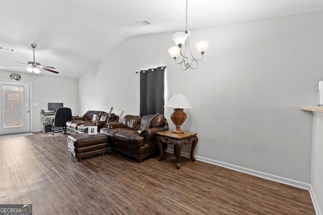 living room with vaulted ceiling, ceiling fan with notable chandelier, and dark hardwood / wood-style flooring