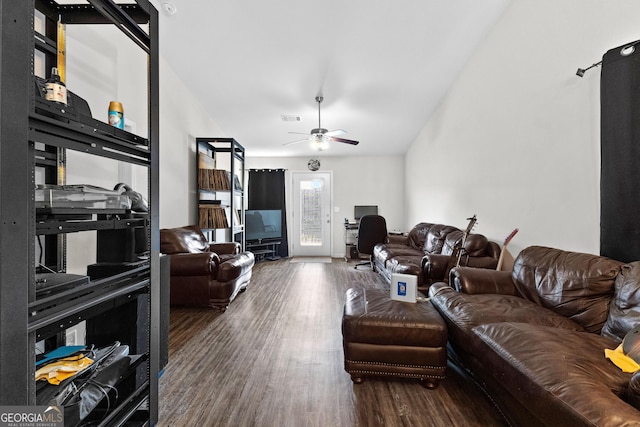 living room featuring ceiling fan, high vaulted ceiling, and dark hardwood / wood-style flooring