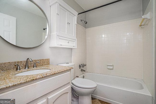 full bathroom with tiled shower / bath combo, vanity, and toilet