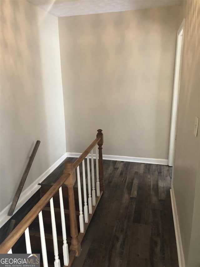 hall with dark hardwood / wood-style flooring