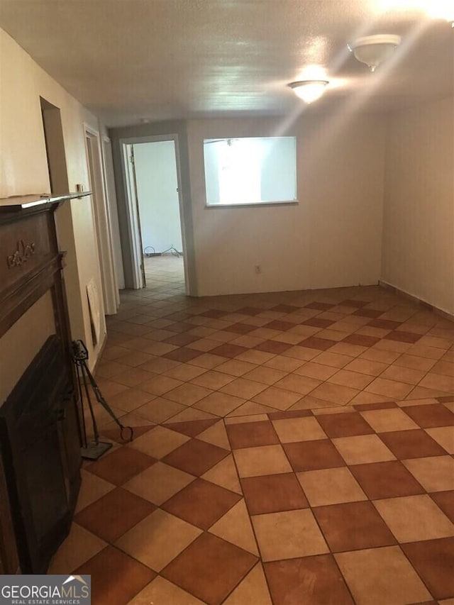 spare room with tile patterned flooring