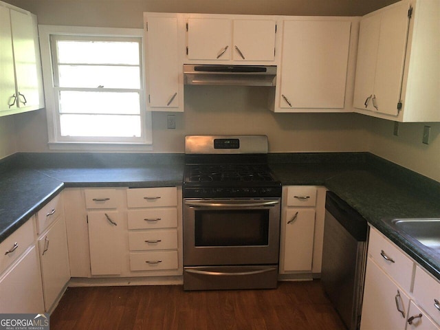 kitchen featuring white cabinetry, appliances with stainless steel finishes, ventilation hood, and dark wood-type flooring