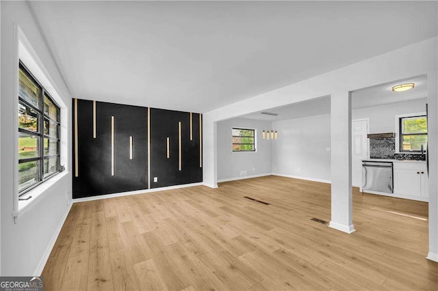 unfurnished living room featuring light hardwood / wood-style flooring