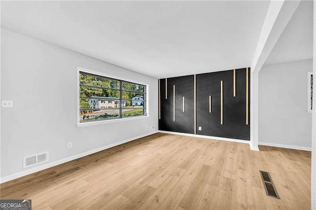 unfurnished room featuring light wood-type flooring