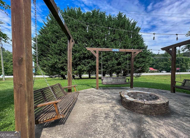 view of patio / terrace with an outdoor fire pit