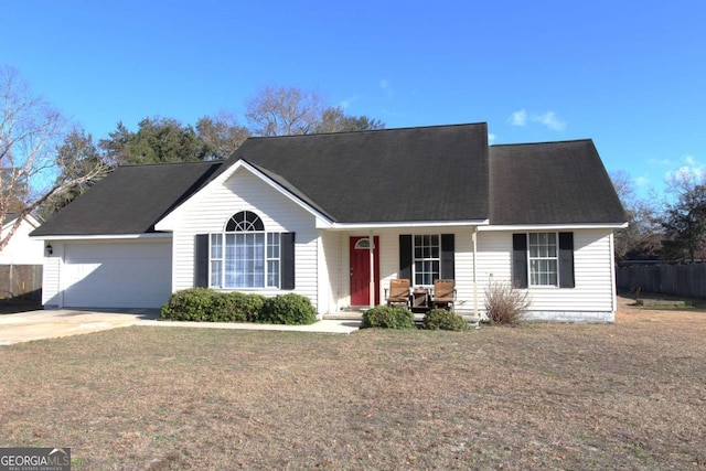 ranch-style house featuring a garage and a front yard