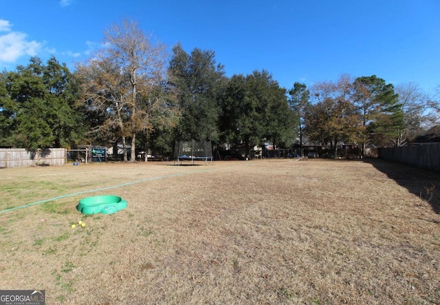 view of yard with a trampoline