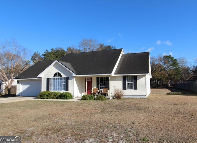 view of front of house with a garage and a front yard