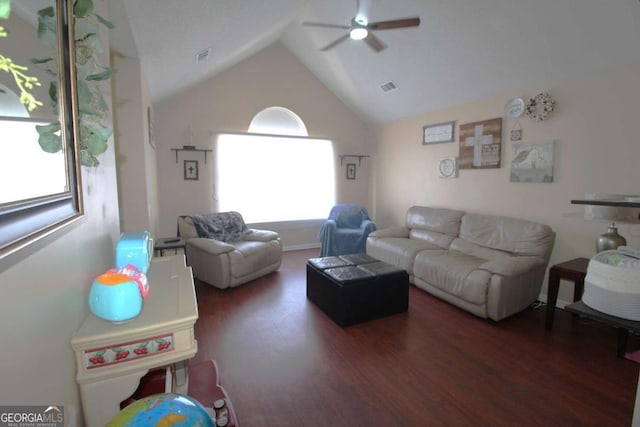 living room with vaulted ceiling, ceiling fan, and dark hardwood / wood-style flooring