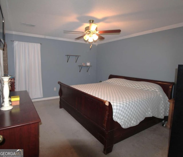 bedroom featuring ornamental molding, light carpet, and ceiling fan