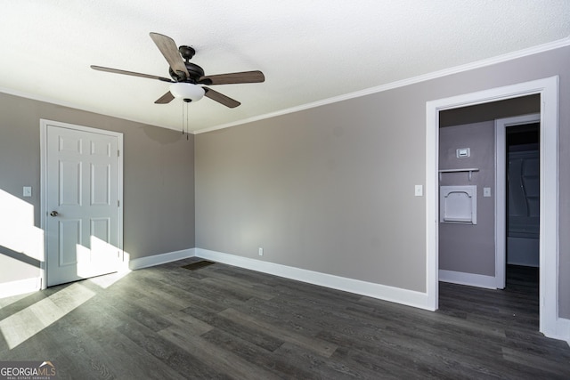 unfurnished room with ornamental molding, dark hardwood / wood-style floors, and ceiling fan