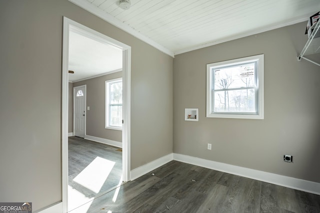interior space with crown molding, hookup for a washing machine, dark wood-type flooring, and hookup for an electric dryer
