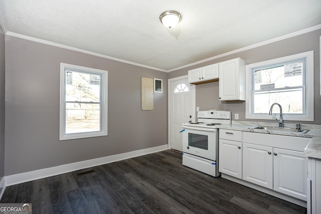 kitchen with a healthy amount of sunlight, white electric stove, white cabinetry, sink, and dark wood-type flooring