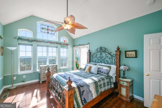 bedroom with dark wood-type flooring, ceiling fan, and vaulted ceiling