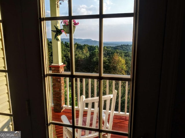 doorway to outside featuring a mountain view