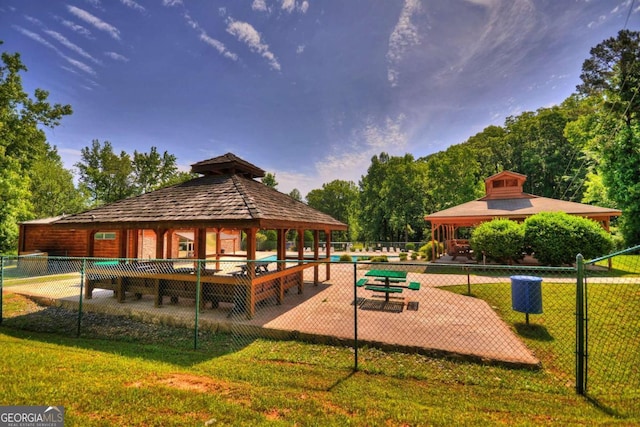 view of home's community with a gazebo and a lawn