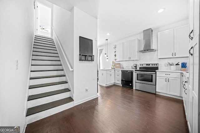 kitchen with dark hardwood / wood-style floors, white cabinetry, black dishwasher, electric range, and wall chimney exhaust hood