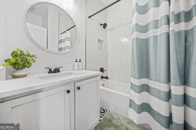 bathroom with vanity and shower / bath combo with shower curtain