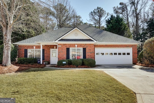 view of front of home featuring a garage and a front yard