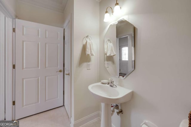 bathroom with a chandelier