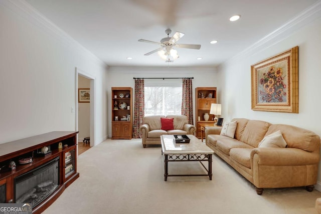 carpeted living room featuring crown molding and ceiling fan