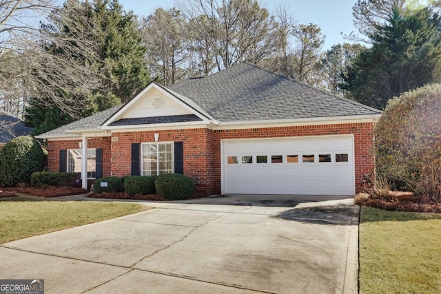 view of front of property with a garage and a front yard