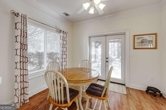 dining room featuring ornamental molding and a healthy amount of sunlight