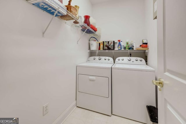 clothes washing area with washer and dryer