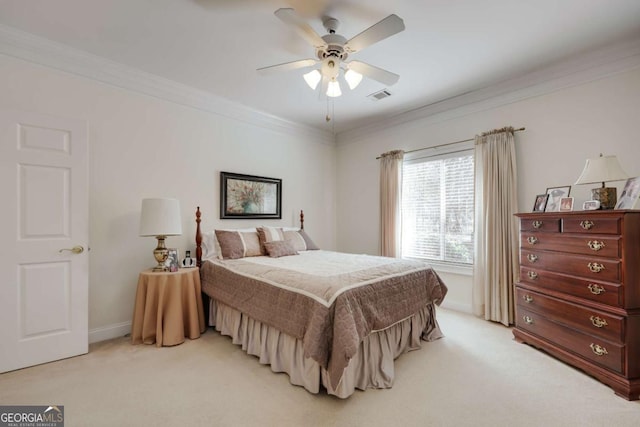 bedroom featuring ornamental molding, light colored carpet, and ceiling fan