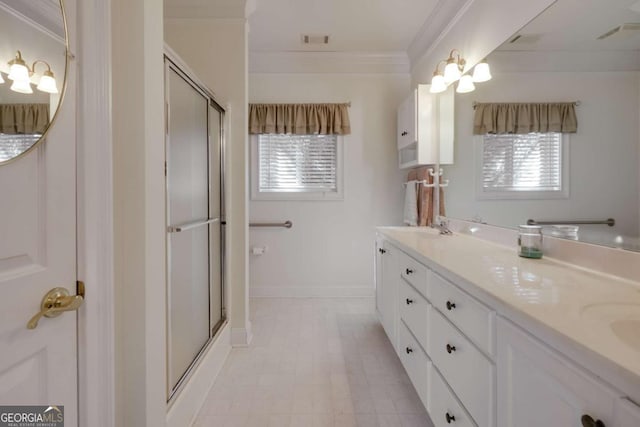 bathroom featuring crown molding, vanity, and walk in shower