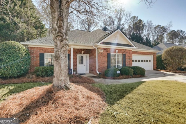 ranch-style house with a garage and a front lawn