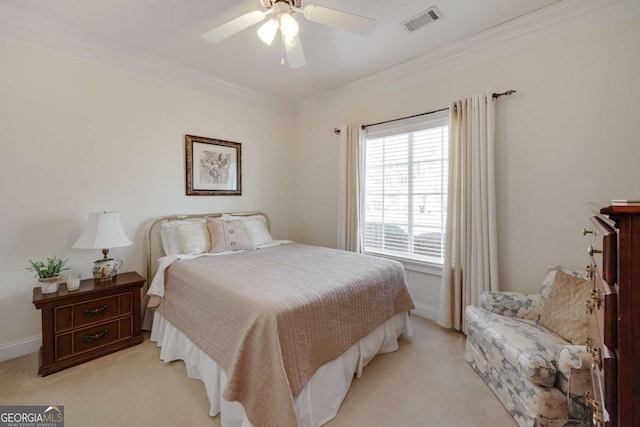 bedroom featuring ceiling fan, light colored carpet, and ornamental molding