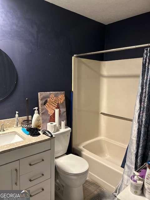 full bathroom featuring vanity, toilet, and shower / bath combo with shower curtain