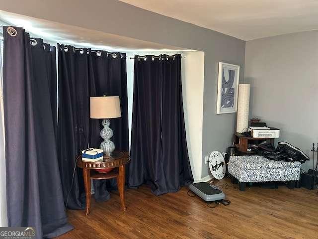 bedroom with wood-type flooring