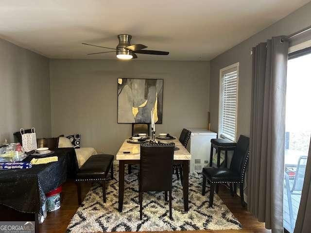 dining space featuring dark hardwood / wood-style floors and ceiling fan