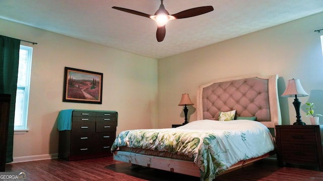 bedroom featuring ceiling fan and dark hardwood / wood-style floors