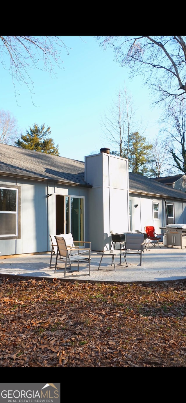 rear view of house featuring a patio