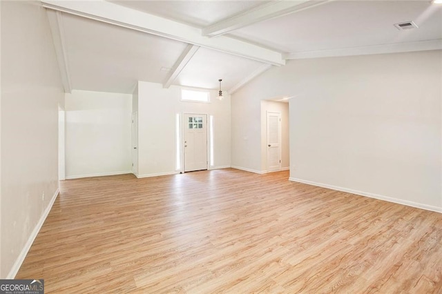 foyer featuring lofted ceiling with beams and light hardwood / wood-style flooring