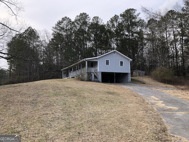 view of side of home with a yard