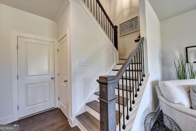 stairway with hardwood / wood-style flooring