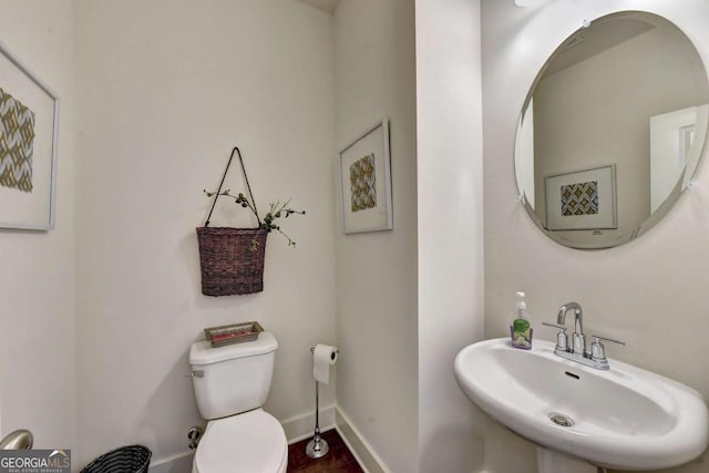 bathroom featuring sink and toilet