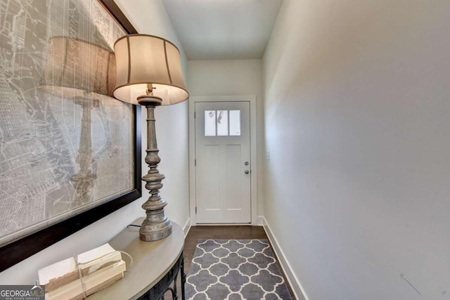 doorway with dark hardwood / wood-style floors